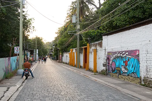 El Tunco Street Street with graffiti on a wall.